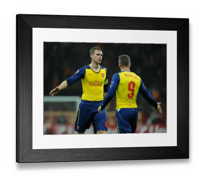 Framed Print : Per Mertesacker and Lukas Podolski: Arsenal's Unity in Istanbul, Turkey - Galatasaray vs Arsenal, UEFA Champions League 2014 / 15