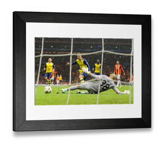 Framed Print : Podolski Scores Double: Arsenal Crush Galatasaray in Champions League Showdown