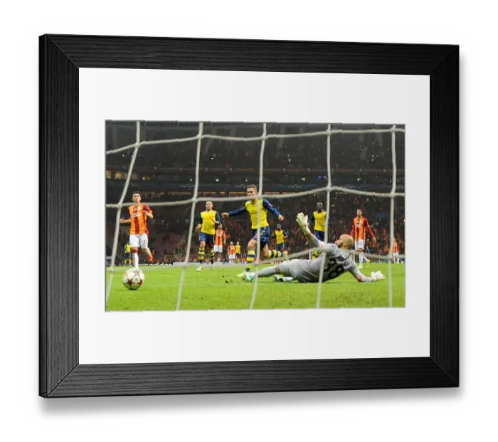 Framed Print : Lukas Podolski's Double Strike: Arsenal's Victory Over Galatasaray in UEFA Champions League (2014 / 15)