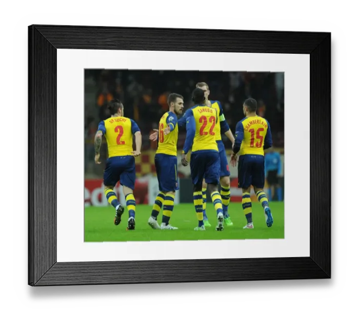 Framed Print : Ramsey and Sanogo Celebrate Arsenal's Champions League Goals Against Galatasaray Framed Print : Ramsey and Sanogo Celebrate Arsenal's Champions League Goals Against Galatasaray