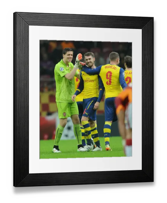 Framed Print : Arsenal's Triumph: Ramsey, Podolski, Szczesny Celebrate Goals Against Galatasaray in Champions League Framed Print : Arsenal's Triumph: Ramsey, Podolski, Szczesny Celebrate Goals Against Galatasaray in Champions League