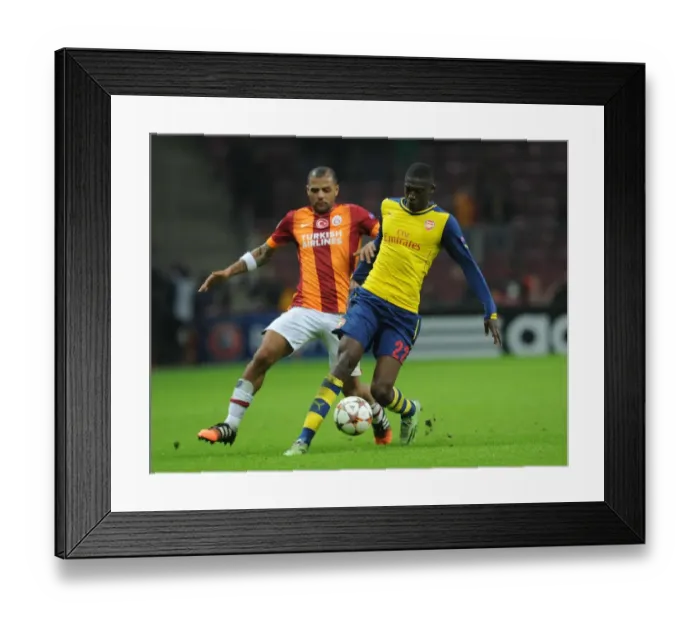 Framed Print : Ramsey Outmaneuvers Melo: Arsenal vs. Galatasaray, UEFA Champions League, Istanbul, 2014
