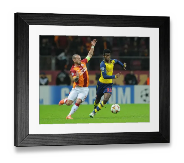 Framed Print : Arsenal's Zelalem Outsmarts Sneijder: Young Prodigy Dazzles in UEFA Champions League Clash Framed Print : Arsenal's Zelalem Outsmarts Sneijder: Young Prodigy Dazzles in UEFA Champions League Clash