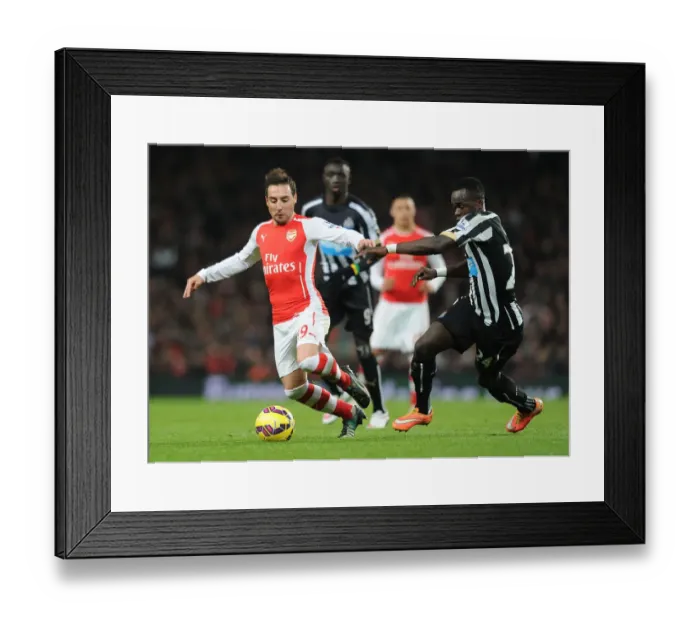 Framed Print : Arsenal's Santi Cazorla Dodges Newcastle's Cheick Tiote at the Emirates Stadium, 2014 / 15 Premier League Framed Print : Arsenal's Santi Cazorla Dodges Newcastle's Cheick Tiote at the Emirates Stadium, 2014 / 15 Premier League
