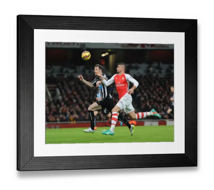 Framed Print : Arsenal vs Newcastle United: Olivier Giroud Faces Mike Williamson in Premier League Clash (December 2014)