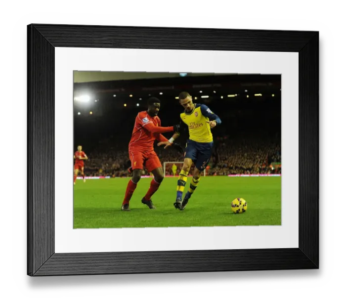Framed Print : Clash at Anfield: Gibbs vs. Toure - A Premier League Battle