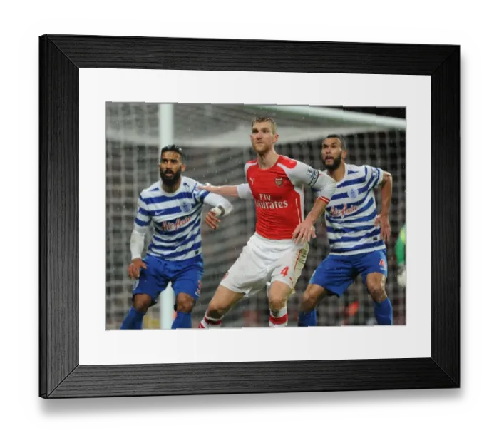 Framed Print : Arsenal vs. Queens Park Rangers: Per Mertesacker Faces Off Against Armand Traore and Steven Caulker Framed Print : Arsenal vs. Queens Park Rangers: Per Mertesacker Faces Off Against Armand Traore and Steven Caulker