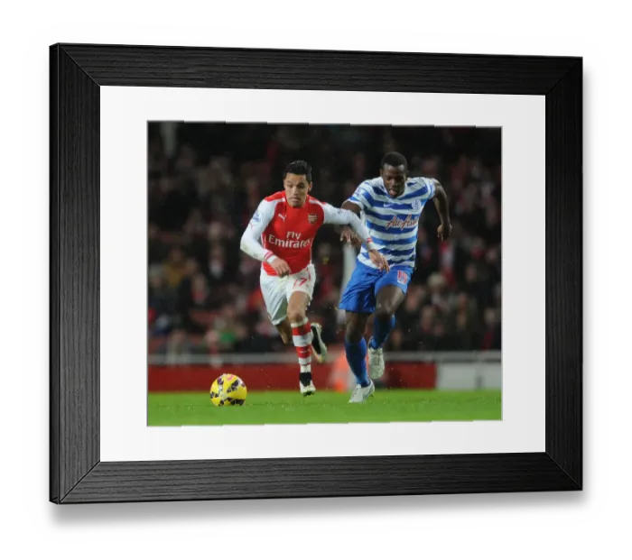 Framed Print : Arsenal's Alexis Sanchez Faces Off Against Nedum Onuoha in Premier League Clash (Arsenal v Queens Park Rangers 2014-15)