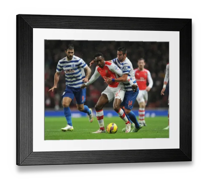 Framed Print : Arsenal's Danny Welbeck Clashes with Mauricio Isla of QPR during Premier League Match