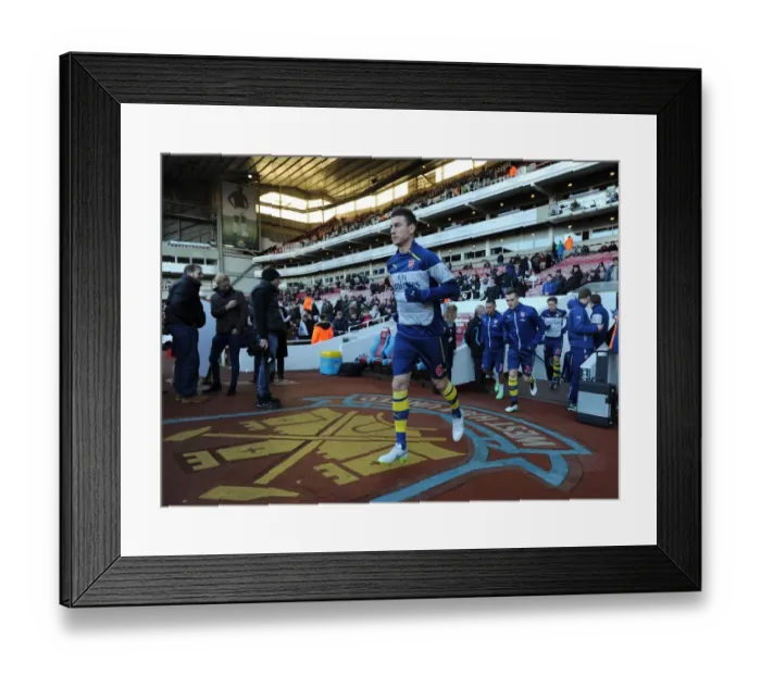 Framed Print : Laurent Koscielny Gearing Up: Arsenal vs. West Ham United, Premier League (2014-15)