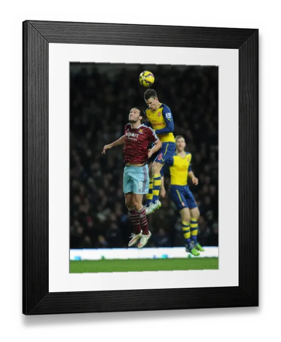 Framed Print : Clash at the Boleyn: Koscielny vs. Carroll in the Premier League Showdown Framed Print : Clash at the Boleyn: Koscielny vs. Carroll in the Premier League Showdown