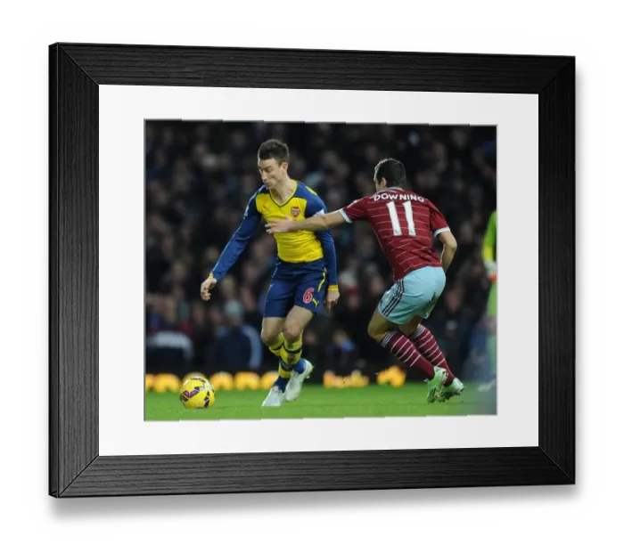 Framed Print : Koscielny Surges Past Downing: West Ham vs. Arsenal, Premier League 2014-15 Framed Print : Koscielny Surges Past Downing: West Ham vs. Arsenal, Premier League 2014-15
