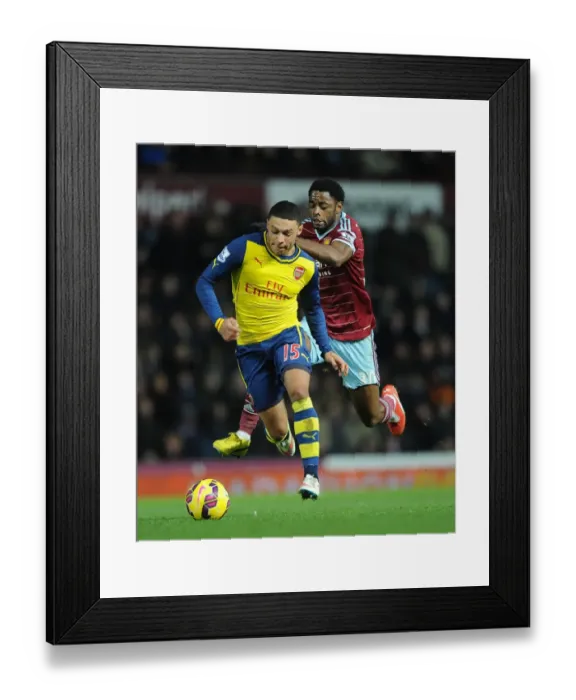 Framed Print : Clash of Midfielders: Oxlade-Chamberlain vs. Song (West Ham vs. Arsenal, 2014-15) Framed Print : Clash of Midfielders: Oxlade-Chamberlain vs. Song (West Ham vs. Arsenal, 2014-15)