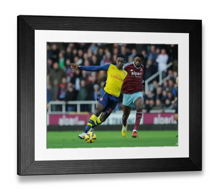 Framed Print : Danny Welbeck vs. Alex Song: Battle in the Premier League - Arsenal vs. West Ham United (December 2014)