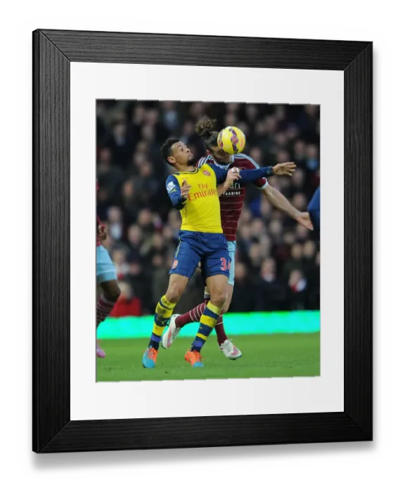 Framed Print : Coquelin vs. Carroll: Intense Battle in West Ham United vs. Arsenal Premier League Clash Framed Print : Coquelin vs. Carroll: Intense Battle in West Ham United vs. Arsenal Premier League Clash