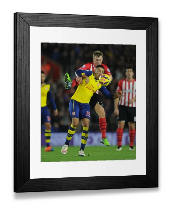 Framed Print : Clash at St. Mary's: Oxlade-Chamberlain vs. Ward-Prowse in Southampton v Arsenal (2014-15)