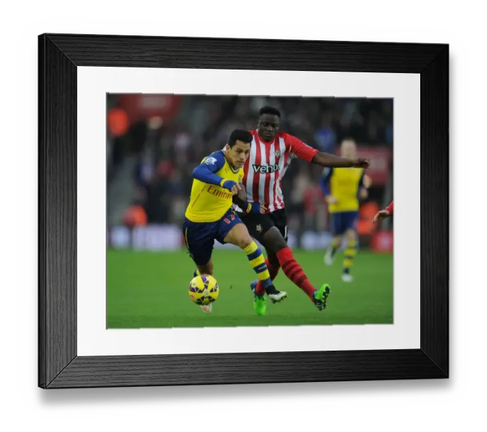 Framed Print : Clash at St. Mary's: Sanchez vs. Wanyama in Southampton v Arsenal (2014-15)