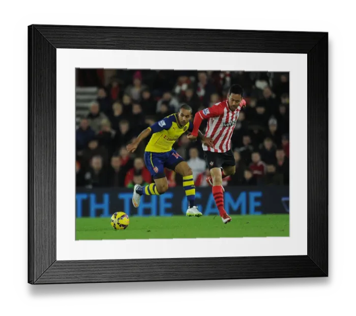 Framed Print : Theo Walcott vs Maya Yoshida: A Battle in the Southampton vs Arsenal Premier League Clash (January 2015)