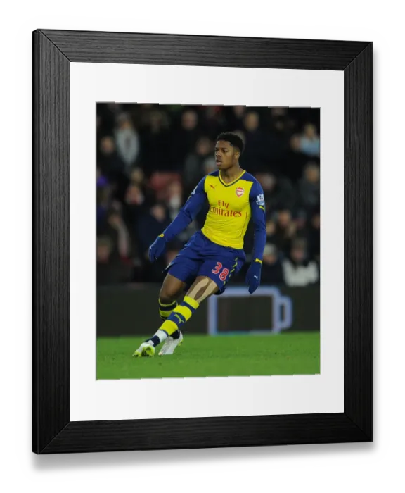 Framed Print : Arsenal's Chuba Akpom Faces Off Against Southampton in Premier League Clash (January 2015)