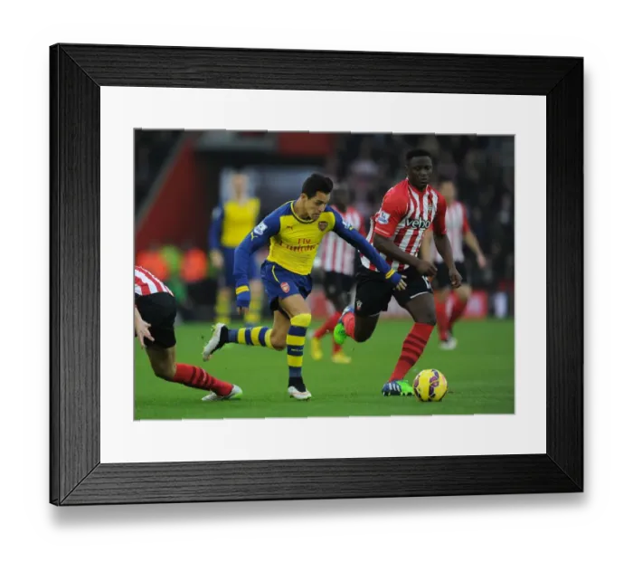 Framed Print : Sanchez vs. Wanyama: A Premier League Battle at St. Mary's - Arsenal vs. Southampton, 2014-15