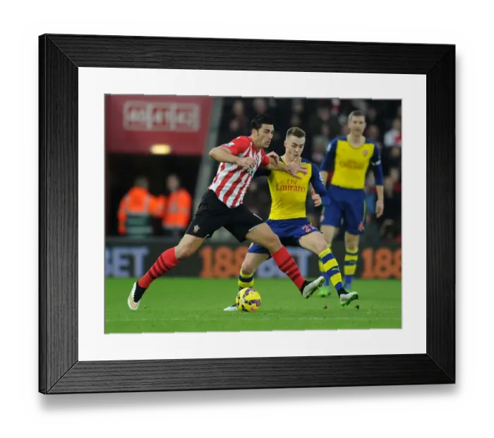 Framed Print : Arsenal's Calum Chambers Closes Down Southampton's Graziano Pelle in Premier League Clash (Southampton v Arsenal 2014-15)
