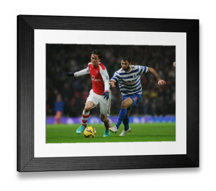 Framed Print : Arsenal's Tomas Rosicky Outmaneuvers QPR's Charlie Austin during the 2014-15 Premier League Match Framed Print : Arsenal's Tomas Rosicky Outmaneuvers QPR's Charlie Austin during the 2014-15 Premier League Match