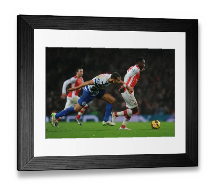 Framed Print : Arsenal vs. QPR: Tense Moment Between Danny Welbeck and Rio Ferdinand Framed Print : Arsenal vs. QPR: Tense Moment Between Danny Welbeck and Rio Ferdinand