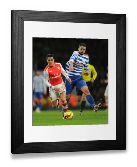 Framed Print : Arsenal's Alexis Sanchez Outmaneuvers QPR's Nico Kranjcar during the 2014-15 Premier League Match Framed Print : Arsenal's Alexis Sanchez Outmaneuvers QPR's Nico Kranjcar during the 2014-15 Premier League Match