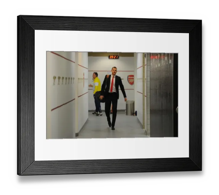 Framed Print : Per Mertesacker in Arsenal Home Changing Room Before Arsenal vs Queens Park Rangers (2014-15)