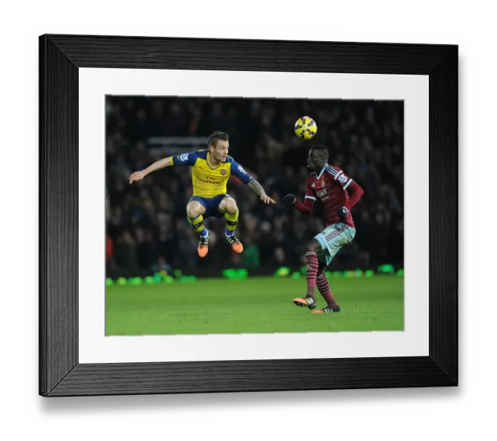 Framed Print : Clash at the Boleyn: Debuchy vs. Kouyate in the West Ham United vs. Arsenal Premier League Battle