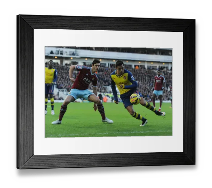 Framed Print : Clash at the Boleyn: Sanchez vs. Tomkins in the Premier League Battle between West Ham and Arsenal