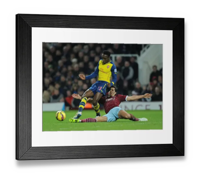 Framed Print : Clash at the Boleyn: Welbeck vs. Tomkins - A Battle in the 2014-15 West Ham United vs. Arsenal Premier League Match Framed Print : Clash at the Boleyn: Welbeck vs. Tomkins - A Battle in the 2014-15 West Ham United vs. Arsenal Premier League Match