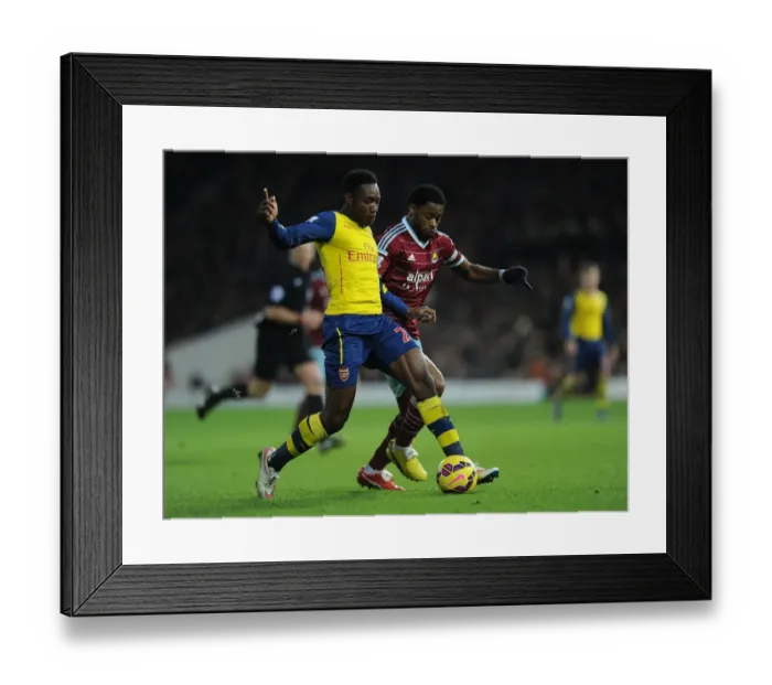 Framed Print : Clash at Boleyn Ground: Welbeck vs. Song in the 2014-15 West Ham United vs. Arsenal Premier League Battle Framed Print : Clash at Boleyn Ground: Welbeck vs. Song in the 2014-15 West Ham United vs. Arsenal Premier League Battle