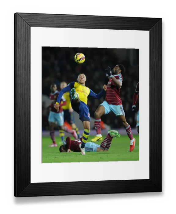 Framed Print : Clash at the Boleyn: Oxlade-Chamberlain vs. Song - West Ham United vs. Arsenal, Premier League 2014-15