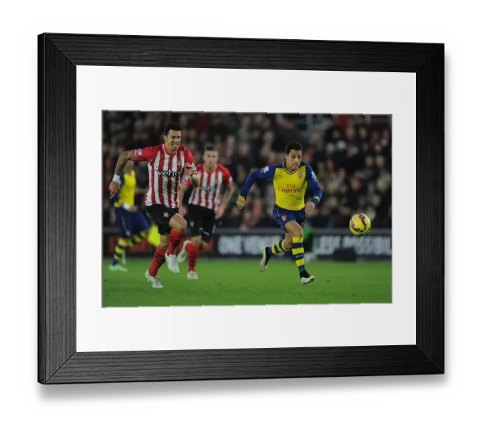 Framed Print : Alexis Sanchez Surges Past Jose Fonte: Southampton vs. Arsenal, Premier League 2014-15