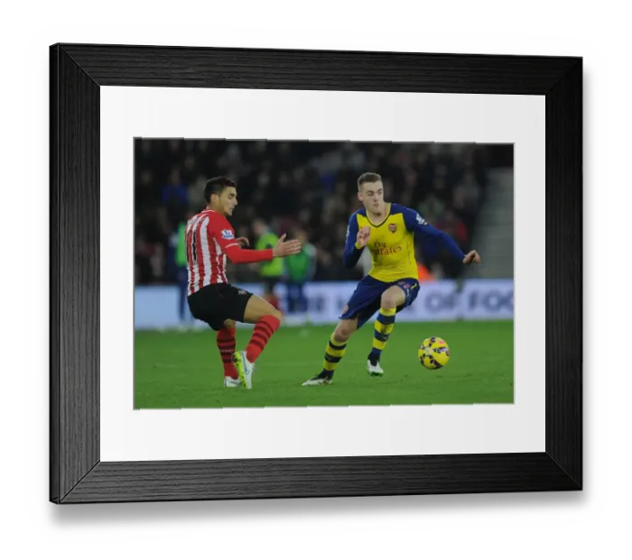 Framed Print : Arsenal's Calum Chambers Outmaneuvers Southampton's Dusan Tadic in Premier League Clash