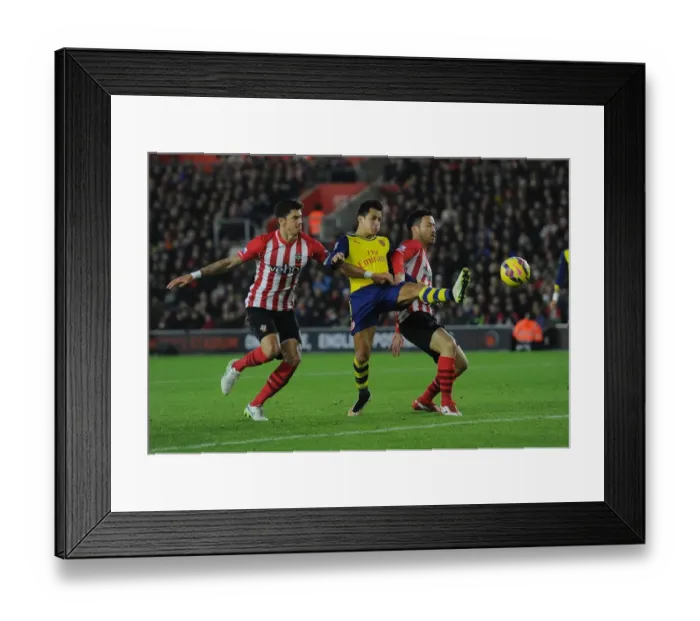 Framed Print : Clash at St. Mary's: Sanchez Faces Off Against Southampton Defenders