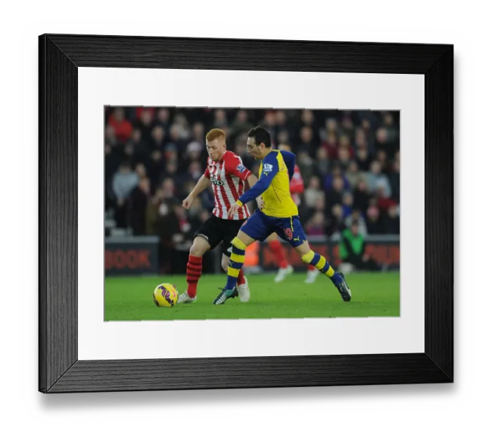 Framed Print : Santi Cazorla vs. Harrison Reed: Intense Battle in Southampton v Arsenal (2014-15)