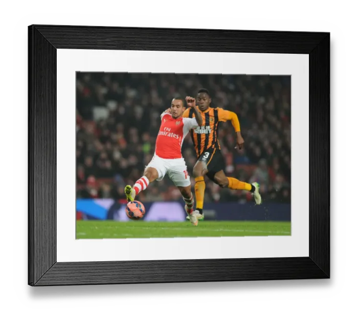 Framed Print : Theo Walcott Surges Past Hull's Maynor Figeroa in FA Cup Third Round Clash at Arsenal's Emirates Stadium Framed Print : Theo Walcott Surges Past Hull's Maynor Figeroa in FA Cup Third Round Clash at Arsenal's Emirates Stadium