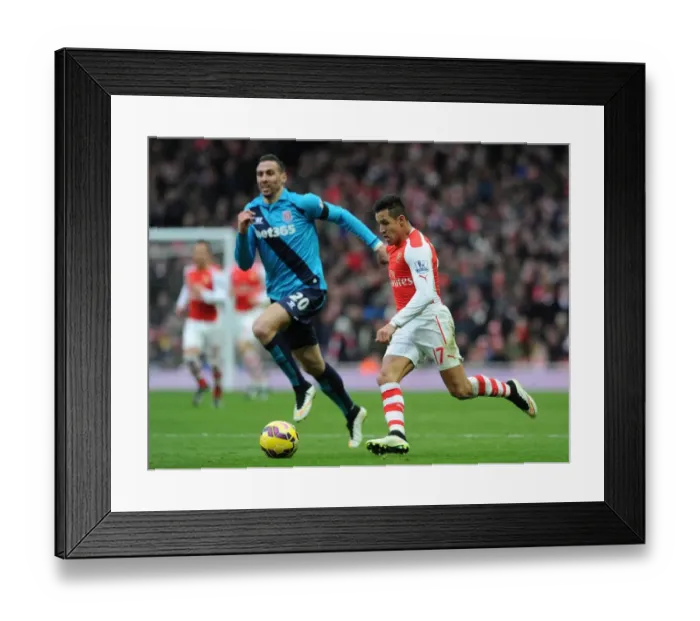 Framed Print : Arsenal's Alexis Sanchez Faces Off Against Stoke's Geoff Cameron in Intense Premier League Clash Framed Print : Arsenal's Alexis Sanchez Faces Off Against Stoke's Geoff Cameron in Intense Premier League Clash