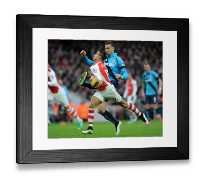 Framed Print : Intense Face-Off: Alexis Sanchez vs. Geoff Cameron - Arsenal's Premier League Battle