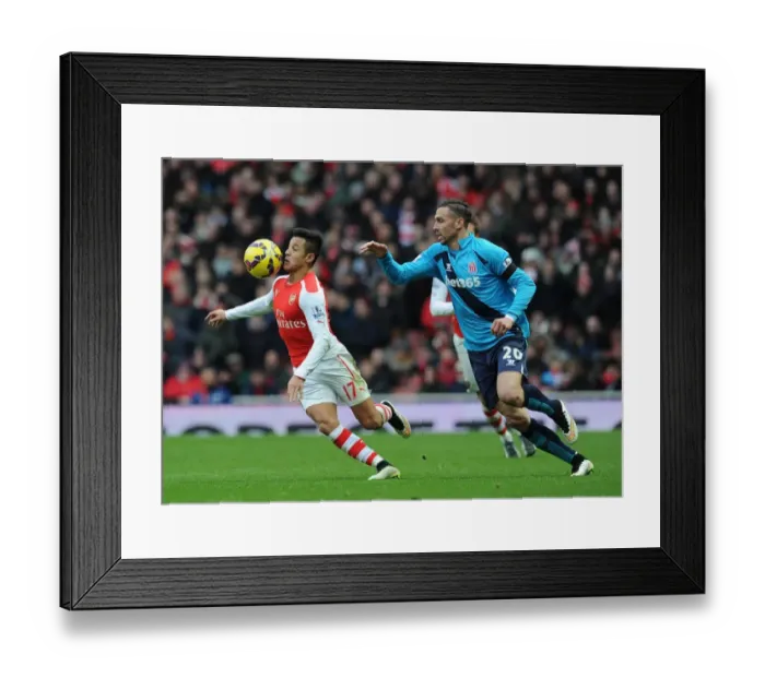 Framed Print : Intense Face-Off: Alexis Sanchez vs. Geoff Cameron - Arsenal's Battle Against Stoke City