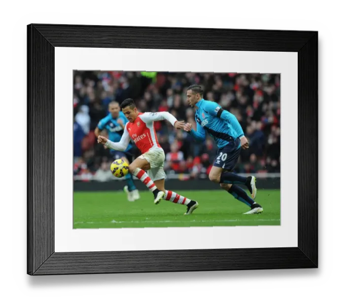 Framed Print : Intense Face-Off: Alexis Sanchez vs. Geoff Cameron - Arsenal's Battle Against Stoke City