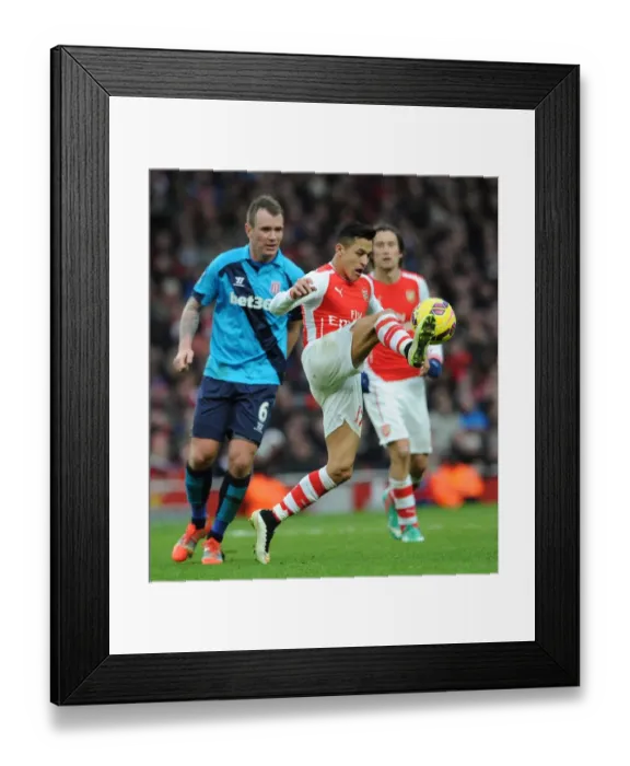 Framed Print : Intense Battle: Alexis Sanchez vs. Glenn Whelan at Arsenal vs. Stoke City (2014-15)