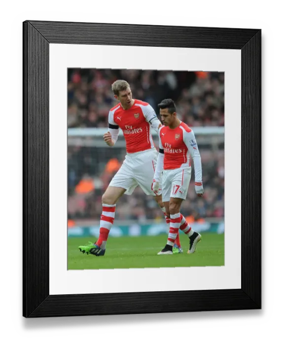Framed Print : Arsenal's Mertesacker and Sanchez in Action against Stoke City (2014-15)