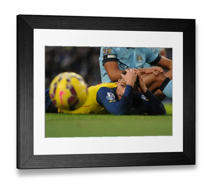 Framed Print : Arsenal's Olivier Giroud Faces Off Against Manchester City in Premier League Clash, 2014-15