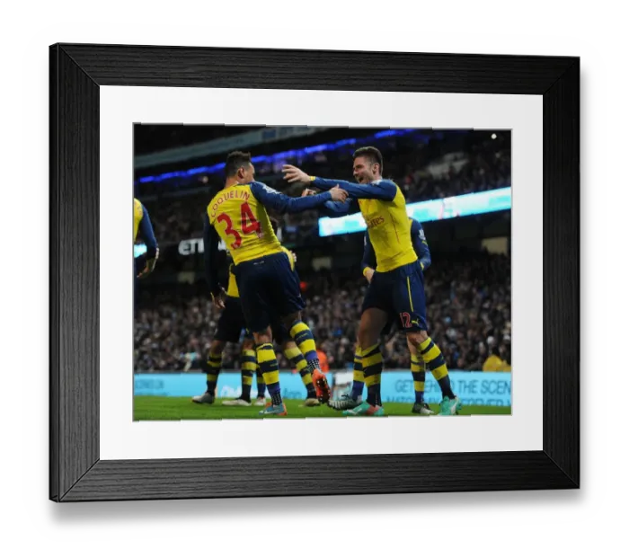 Framed Print : Giroud and Coquelin's Euphoric Goal Celebration: Arsenal's Victory Moment Against Manchester City (2014-15)