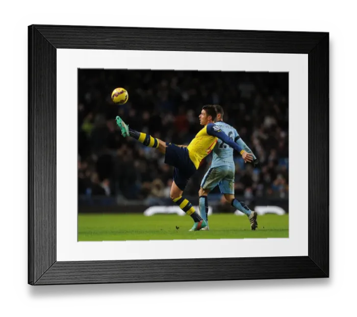 Framed Print : Giroud vs. Demichelis: Intense Battle at the Etihad - Manchester City vs. Arsenal, Premier League 2014-15