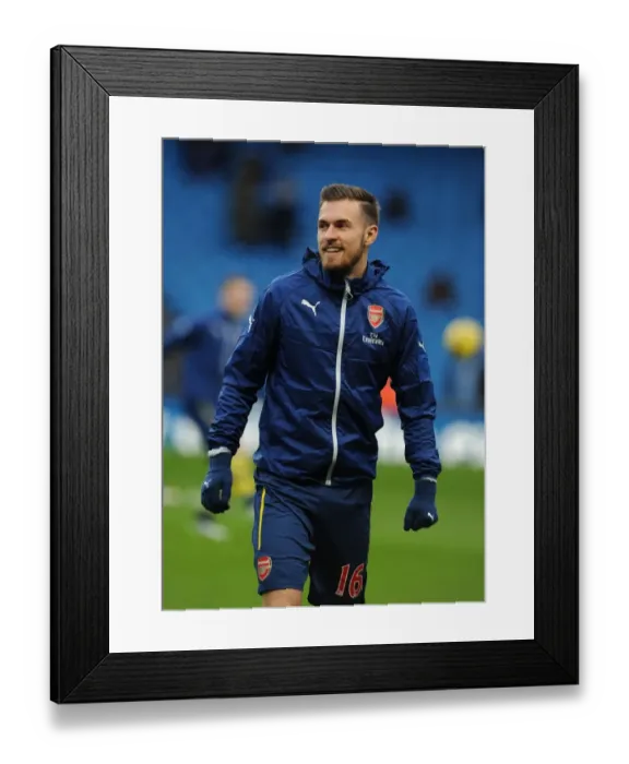 Framed Print : Gearing Up for Battle: Aaron Ramsey's Focus before Manchester City vs Arsenal, Premier League 2014-15