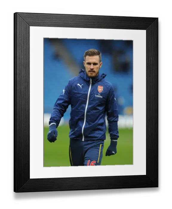 Framed Print : Gearing Up for the Big Battle: Aaron Ramsey's Focused Warm-Up (Manchester City vs Arsenal, Premier League 2014-15) Framed Print : Gearing Up for the Big Battle: Aaron Ramsey's Focused Warm-Up (Manchester City vs Arsenal, Premier League 2014-15)